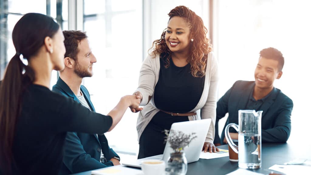 Welcome and business people with a handshake