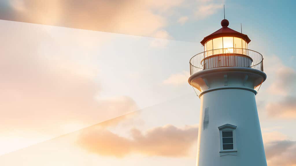 A lighthouse standing tall against the backdrop of a radiant morning sky