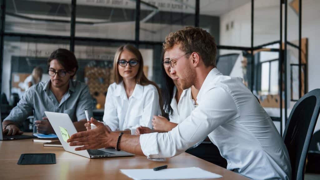 People in formal clothes working in the office